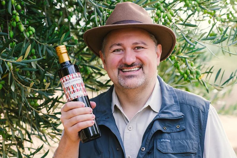 T. J. Robinson, The Olive Oil Hunter, tasting oil at a mill